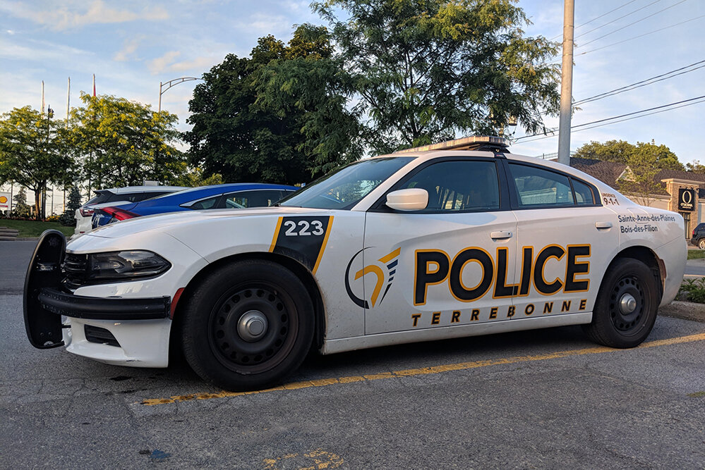 Could contain: land vehicle, vehicle, outdoor, wheel, sky, transport, text, tire, car, police car, full-size car, law enforcement, auto part, police, mid-size car, road, street