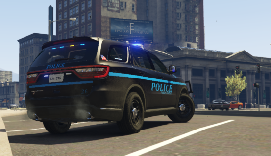 Could contain: vehicle, land vehicle, wheel, outdoor, building, sky, road, tire, transport, emergency vehicle, motor vehicle, automotive exterior, street, emergency service, police car, mode of transport, car, police, city, blue