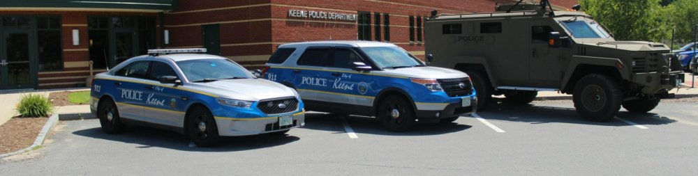 Keene Police Taurus plus other cars.jpg