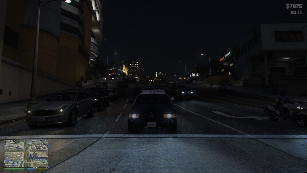 Could contain: vehicle, land vehicle, outdoor, building, sky, wheel, road, car, screenshot, infrastructure, street, way, city, night, light