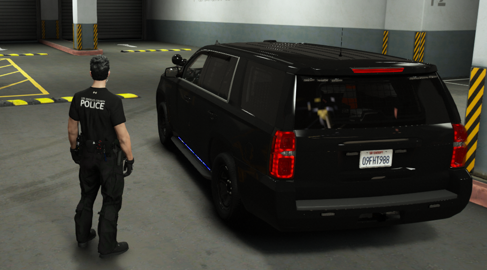 Could contain: vehicle, land vehicle, wheel, tire, car, automotive exterior, bumper, automotive tail & brake light, auto part, sport utility vehicle, man, text, automotive luggage rack, person, roof rack, transport, road, van, indoor, police