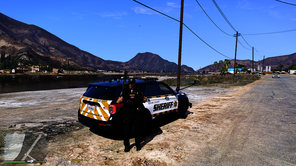 Could contain: outdoor, sky, vehicle, land vehicle, ground, text, tire, wheel, mountain, car, track