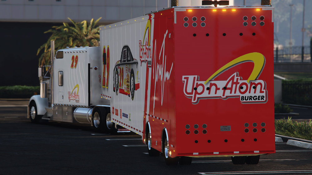 Could contain: text, vehicle, wheel, transport, land vehicle, outdoor, trailer, road, freight transport, commercial vehicle, truck, red