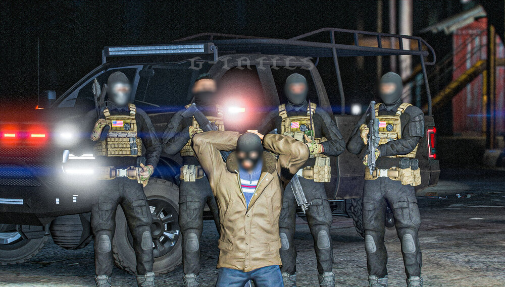 Could contain: vehicle, clothing, tire, land vehicle, outdoor, person, wheel, firefighter, man, auto part, ground, standing, officer, night, police