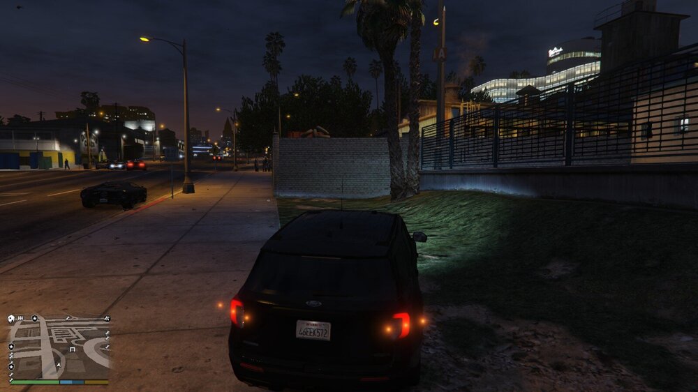 Could contain: outdoor, vehicle, land vehicle, sky, wheel, car, automotive lighting, ground, tire, street light, screenshot, road, street, night, light