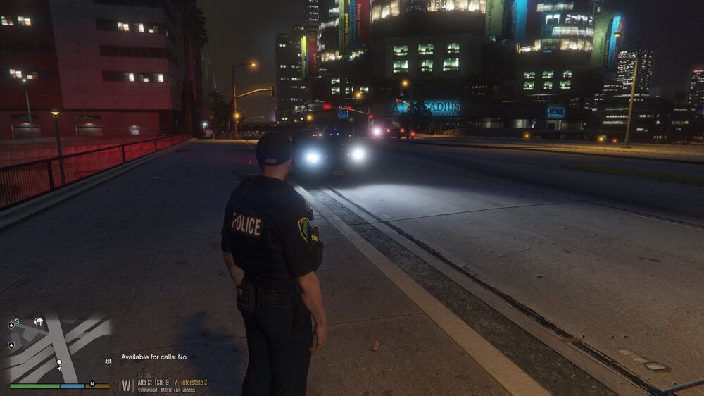 Could contain: clothing, outdoor, skyscraper, person, building, man, road, street, city, night