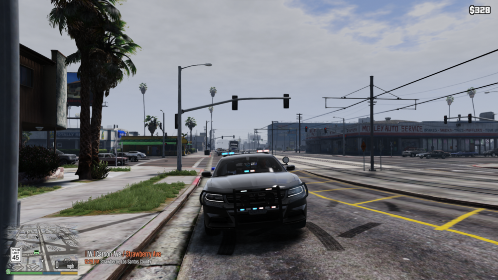 Could contain: outdoor, sky, land vehicle, vehicle, way, cloud, road, tree, car, wheel, street, electricity, thoroughfare, road surface, public utility, ground, track, light