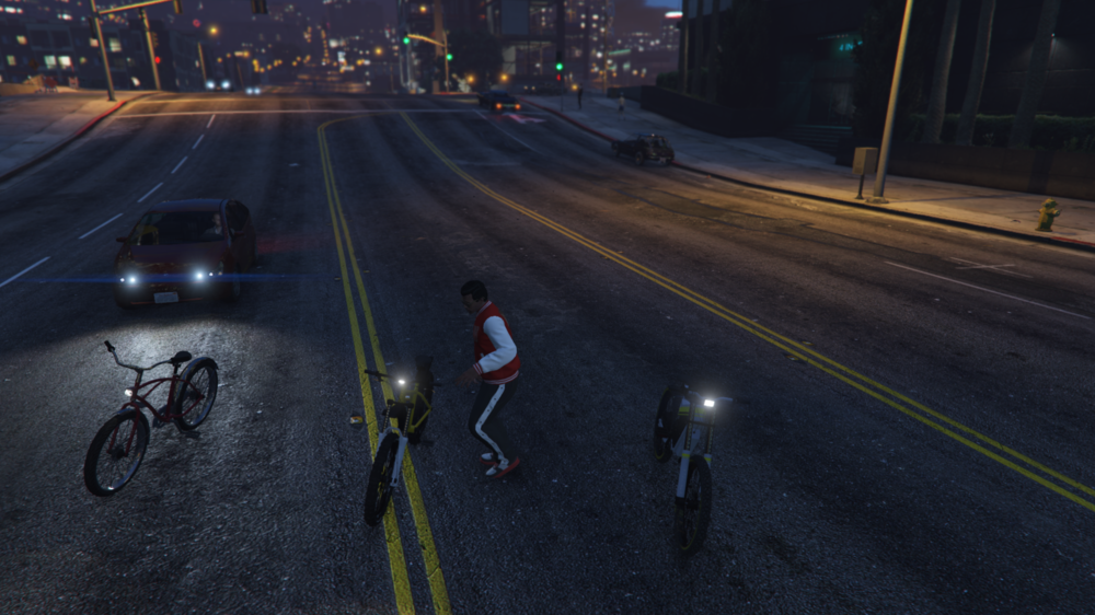 Could contain: land vehicle, outdoor, road, vehicle, wheel, bicycle wheel, street, bike, lane, cycling, street light, bicycle, night, person, way, city, ground, light