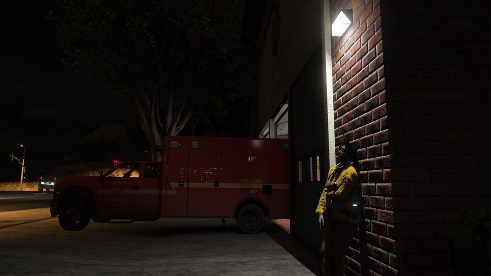 Could contain: vehicle, land vehicle, outdoor, wheel, transport, truck, road, fire, building, tire, firefighter, auto part, night, street, light, parked, red