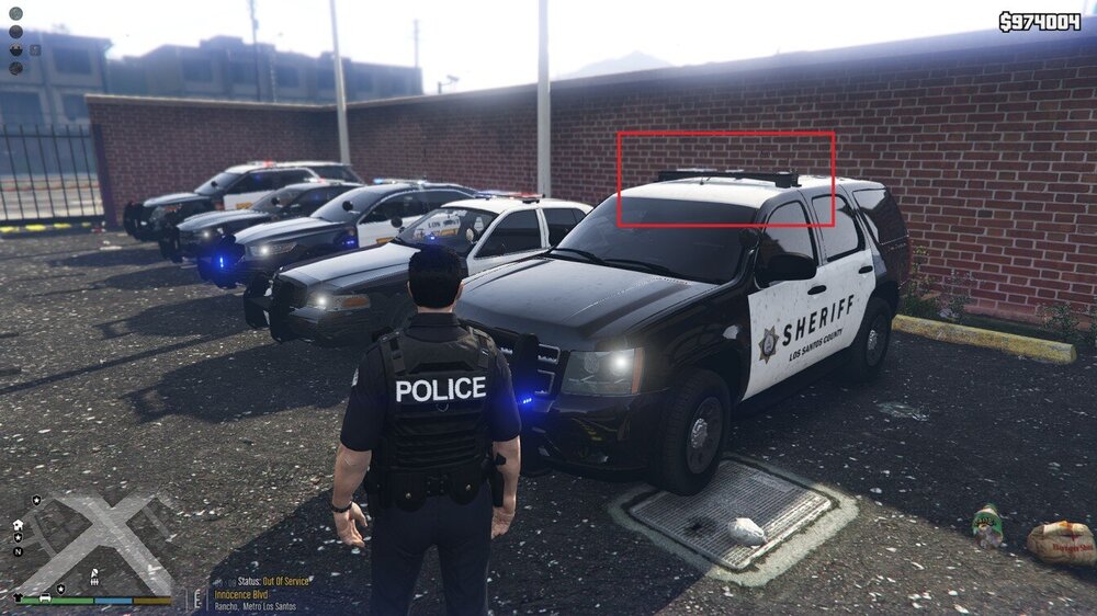 Could contain: vehicle, land vehicle, outdoor, tire, wheel, ground, clothing, car, auto part, motorsport, person, text, footwear, police