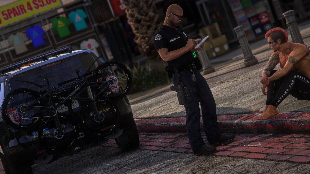 Could contain: clothing, person, man, outdoor, vehicle, land vehicle, tire, footwear, wheel, ground, car, street, sidewalk