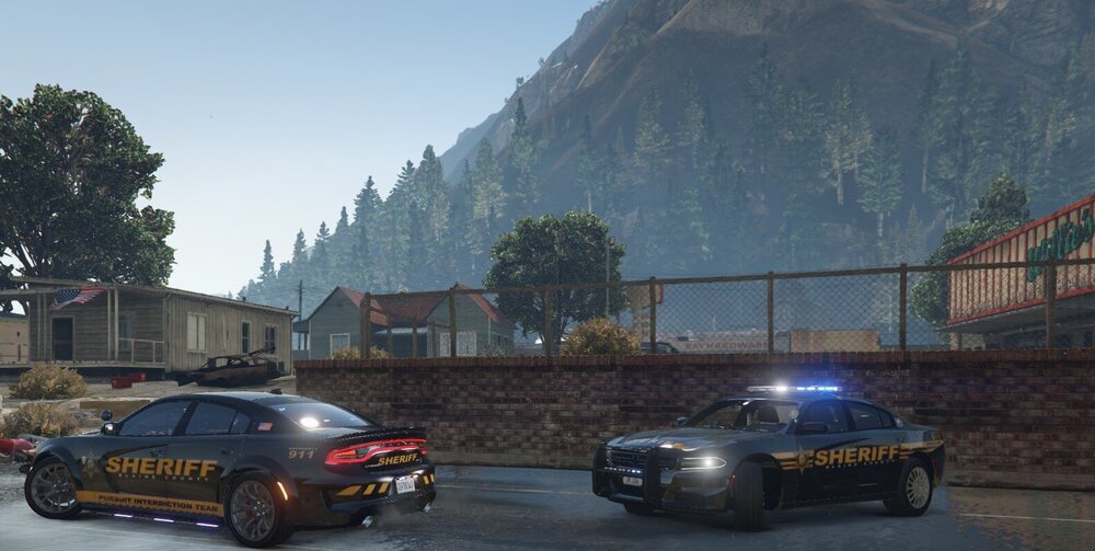 Could contain: vehicle, land vehicle, wheel, outdoor, text, sky, road, vehicle registration plate, tire, tree, mountain, car, sedan, mid-size car, sports sedan, family car, full-size car, auto part, driving, street