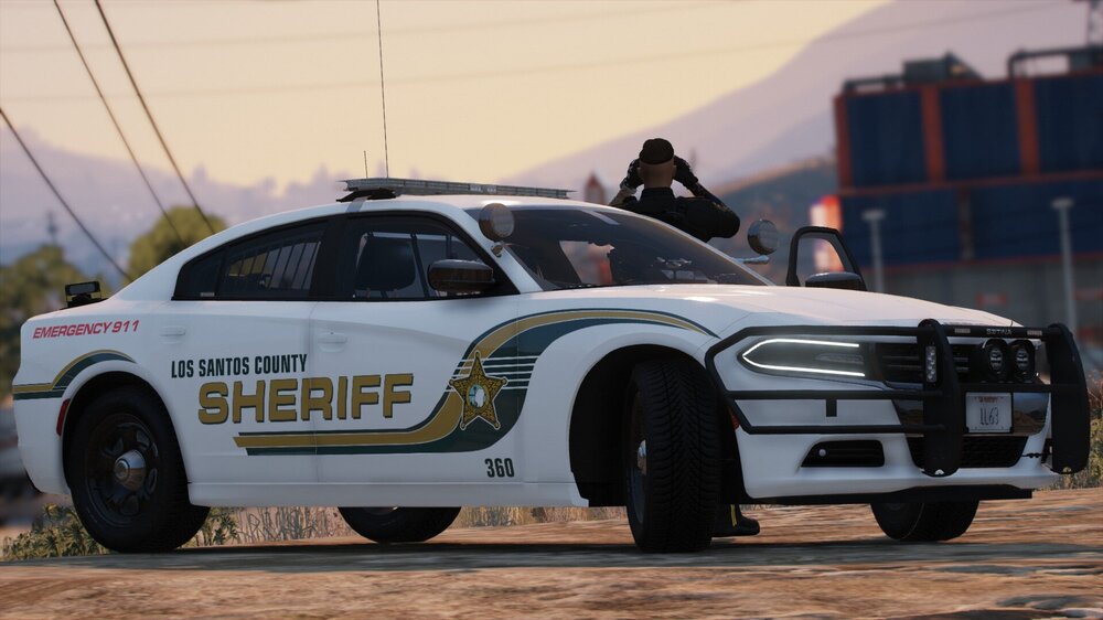 Could contain: vehicle, land vehicle, wheel, tire, sky, outdoor, transport, mid-size car, auto part, bumper, automotive design, full-size car, car, police, ground