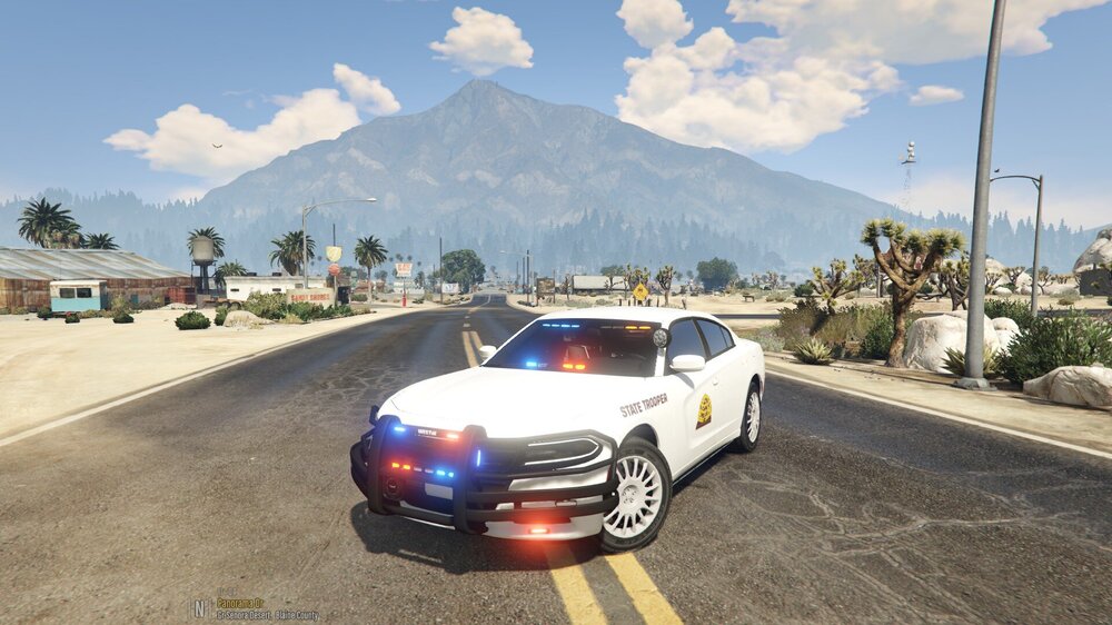 Could contain: vehicle, land vehicle, outdoor, sky, wheel, road, car, tire, bumper, mountain, ground, automotive design, cloud, sedan, parked