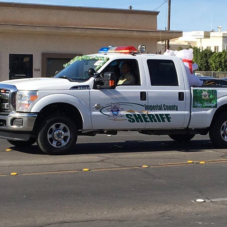 Could contain: vehicle, transport, land vehicle, wheel, outdoor, tire, police, motor vehicle, emergency service, emergency vehicle, truck, auto part, automotive exterior, road, pickup truck, car, emergency, bumper, automotive tire, law enforcement, text, ford, police car, street, parked