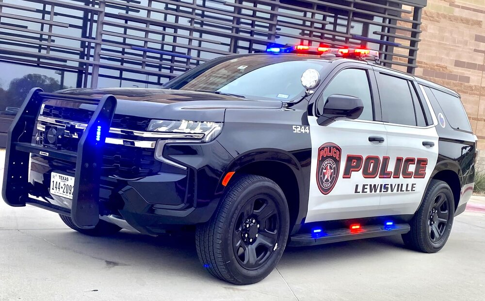 Could contain: vehicle, land vehicle, wheel, tire, text, transport, auto part, law enforcement, police car, bumper, outdoor, automotive exterior, automotive tire, emergency service, emergency vehicle, motor vehicle, police, fender, vehicle registration plate, ford, automotive light bulb, car, emergency