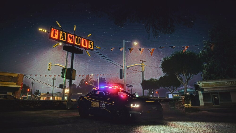 Could contain: outdoor, sky, street light, land vehicle, vehicle, street, wheel, electricity, text, road, billboard, car, tree, night, neon, sign, city, light