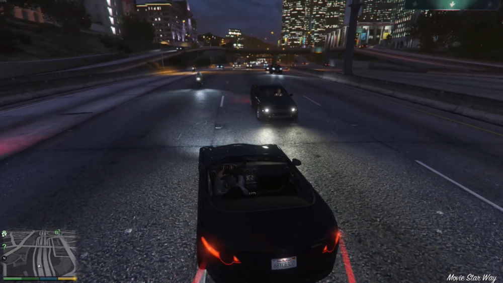 Could contain: vehicle, land vehicle, outdoor, road, car, screenshot, wheel, street, city, night, light