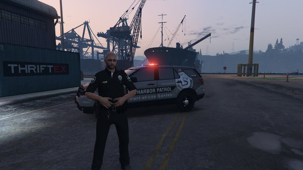 Could contain: sky, vehicle, land vehicle, outdoor, clothing, person, road, wheel, car, tire, man, transport, street, officer