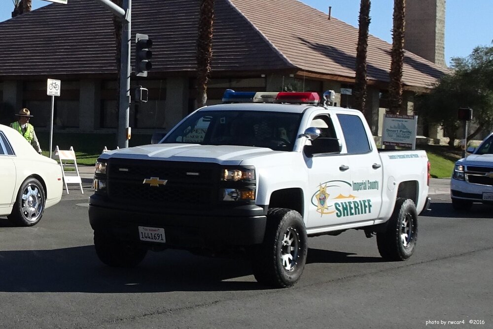 Could contain: vehicle, land vehicle, wheel, tire, outdoor, transport, pickup truck, bumper, auto part, text, truck, building, automotive exterior, coupe utility, sport utility vehicle, motor vehicle, law enforcement, road, car, police