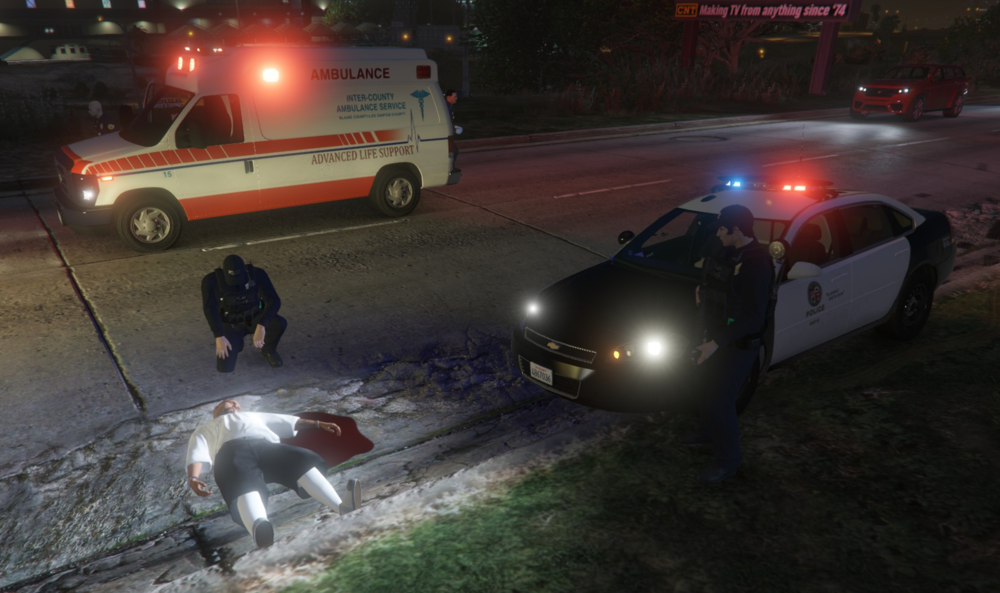 Could contain: vehicle, land vehicle, outdoor, transport, wheel, car, road, ground, night, street, ambulance, light