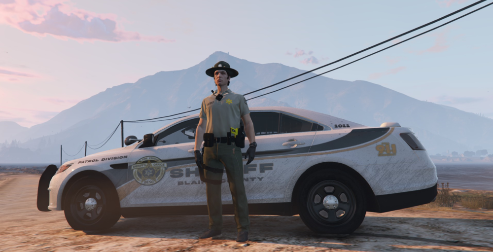 Could contain: outdoor, sky, vehicle, tire, land vehicle, wheel, transport, person, clothing, mountain, car, ground