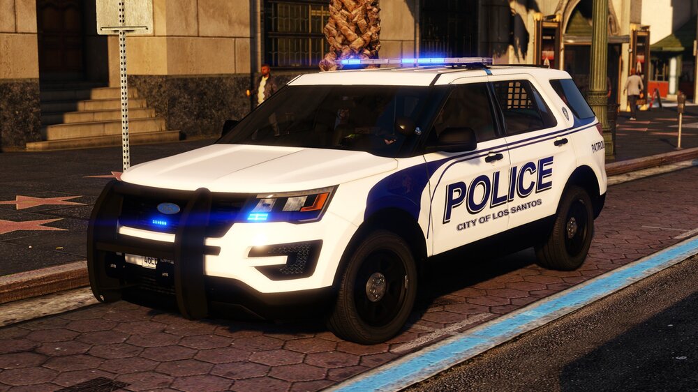 Could contain: vehicle, land vehicle, wheel, transport, text, police car, outdoor, tire, law enforcement, van, building, ford, vehicle registration plate, police van, automotive exterior, street, police, car