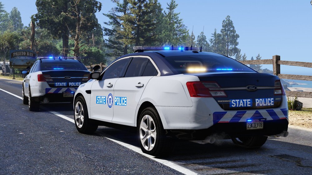 Could contain: land vehicle, vehicle, text, wheel, outdoor, police car, car, full-size car, vehicle registration plate, tire, police, law enforcement, mid-size car, ford, road, auto part, bumper, sports sedan, transport, ford motor company, automotive light bulb, automotive exterior, street