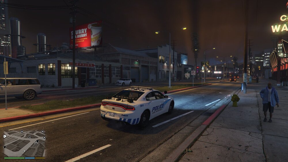 Could contain: vehicle, land vehicle, outdoor, wheel, road, building, transport, street, motorsport, car, text, ground, city, night