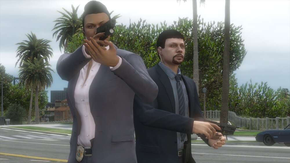 Could contain: outdoor, person, sky, clothing, car, man, tree, land vehicle, road, human face, shoulder, vehicle, palm, suit, street, standing