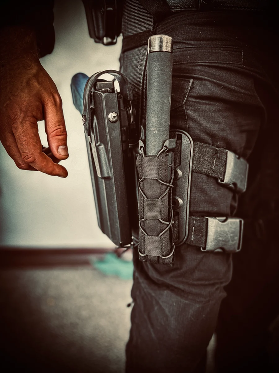 Could contain: person, luggage and bags, clothing, pocket, leather, indoor, belt, standing