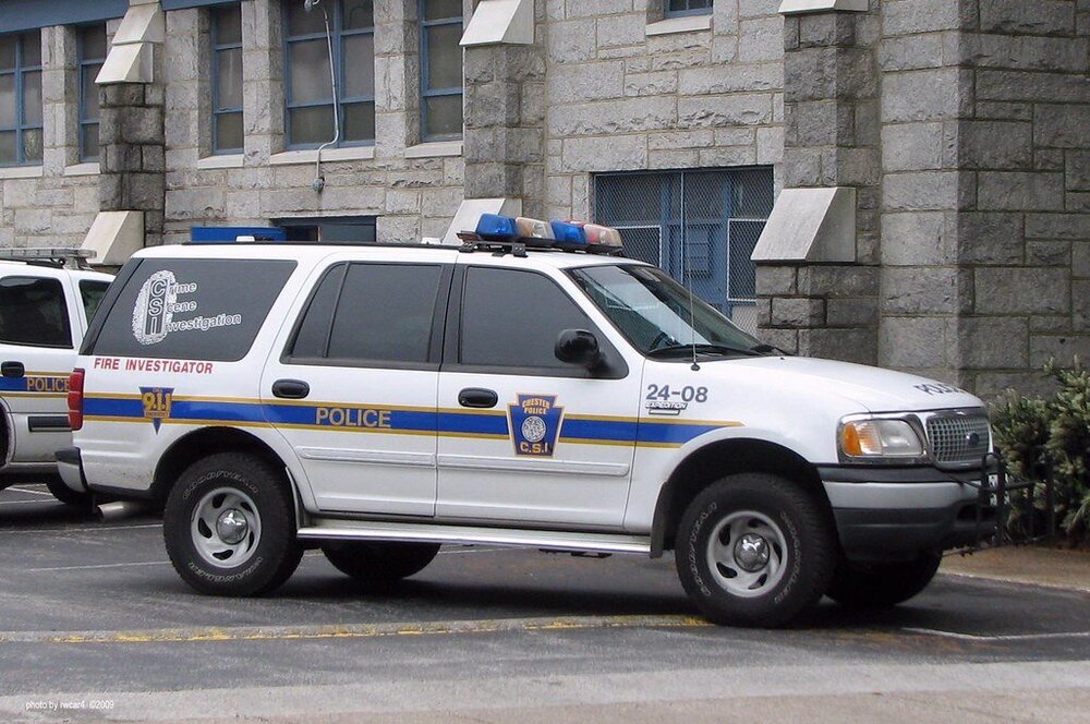 Could contain: vehicle, land vehicle, wheel, transport, outdoor, emergency service, emergency vehicle, law enforcement, police car, emergency, tire, police van, ford, car, text, police, van, street