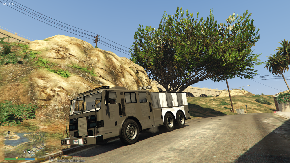 Could contain: outdoor, wheel, vehicle, transport, land vehicle, tree, tire, road, sky, plant, auto part, mountain, street, driving, truck, ground, parked