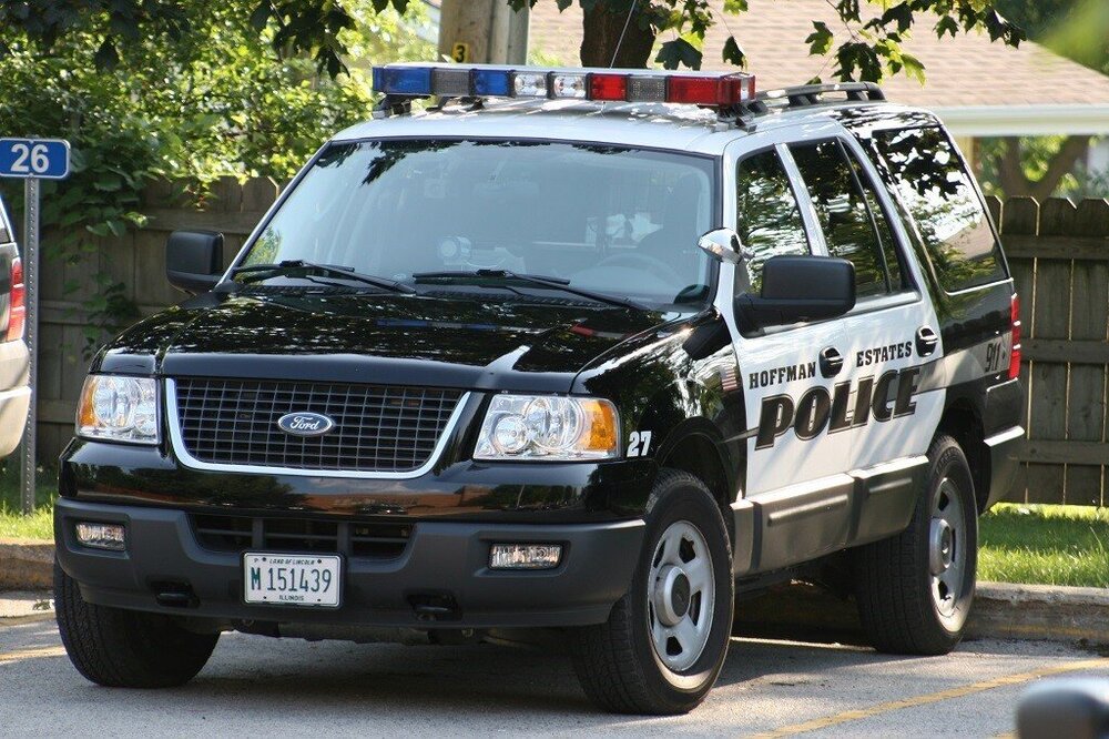 Could contain: land vehicle, vehicle, wheel, text, outdoor, transport, law enforcement, tire, emergency service, emergency vehicle, vehicle registration plate, police, police car, ford, auto part, emergency, bumper, sport utility vehicle, car