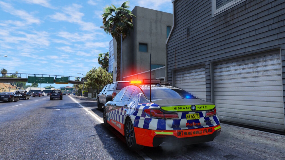 Could contain: vehicle, outdoor, land vehicle, sky, car, road, wheel, emergency service, transport, emergency vehicle, street, police, parked
