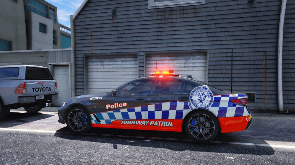 Could contain: land vehicle, vehicle, wheel, text, outdoor, tire, police car, law enforcement, emergency service, emergency vehicle, full-size car, vehicle registration plate, transport, building, road, emergency, auto part, police, car, street, van