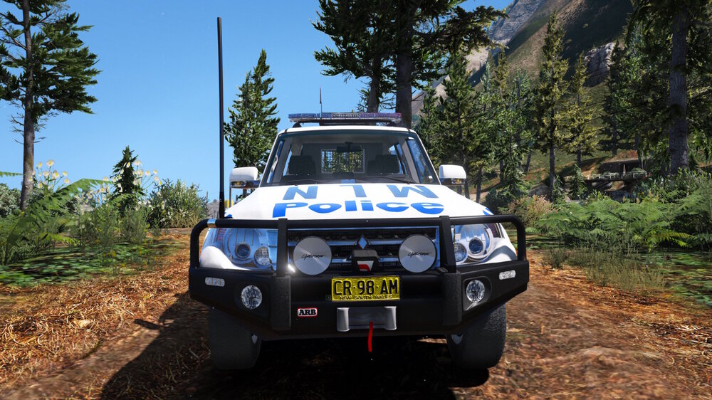 Could contain: outdoor, vehicle, land vehicle, tire, wheel, transport, tree, car, off-roading, bumper, off-road vehicle, automotive tire, automotive exterior, auto part, jeep, motorsport, rally, ground, blue