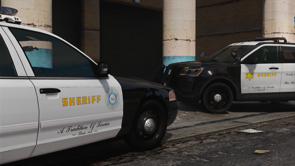 Could contain: vehicle, land vehicle, wheel, tire, text, outdoor, transport, auto part, law enforcement, car, police car, automotive exterior, motor vehicle, building, ford crown victoria police interceptor, automotive luggage rack, vehicle registration plate, automotive carrying rack, roof rack, emergency service, emergency vehicle, ford, police, street, parked, van