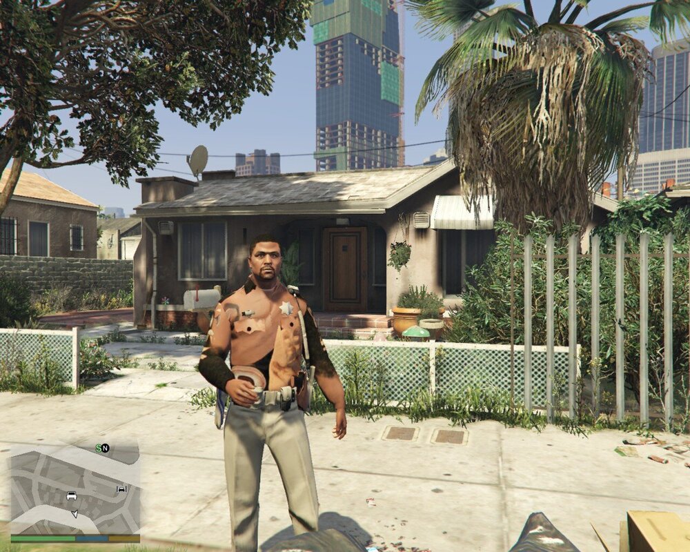 Could contain: outdoor, building, clothing, palm tree, plant, man, tree, person, sky, house, footwear, ground