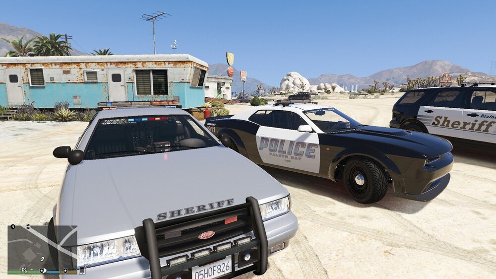 Could contain: vehicle, outdoor, land vehicle, wheel, transport, sky, tire, text, car, ground, parked, mountain