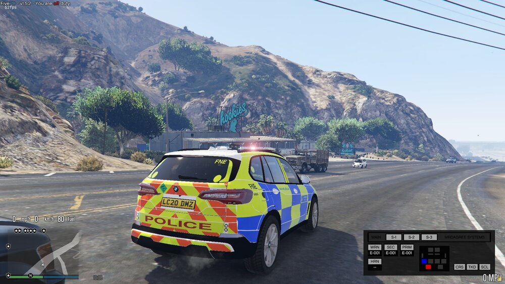 Could contain: vehicle, text, land vehicle, outdoor, wheel, road, sky, car, transport, tire, mountain, truck, motor vehicle, mode of transport, street