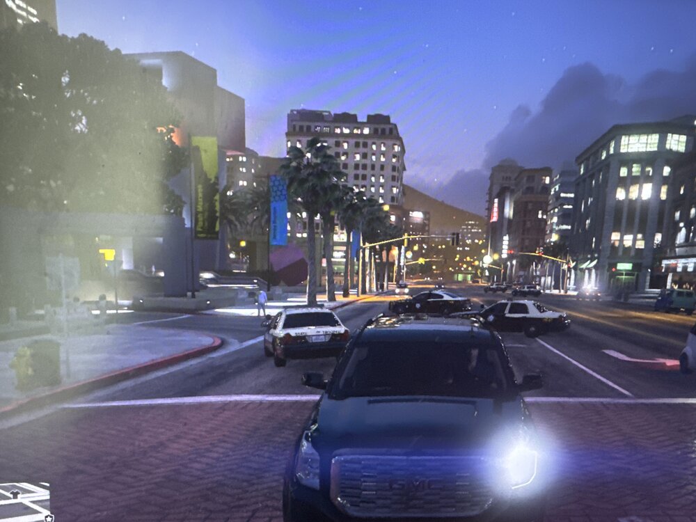 Could contain: vehicle, land vehicle, outdoor, building, sky, wheel, road, city, street, family car, mid-size car, fog, automotive lighting, light, night, car