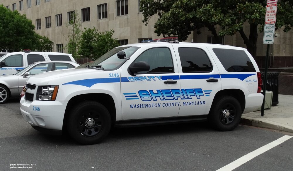 Could contain: vehicle, land vehicle, transport, text, wheel, law enforcement, outdoor, police car, tire, car, emergency vehicle, emergency service, auto part, ford, automotive exterior, police van, motor vehicle, vehicle registration plate, emergency, bumper, ford crown victoria police interceptor, van, police, parked, street