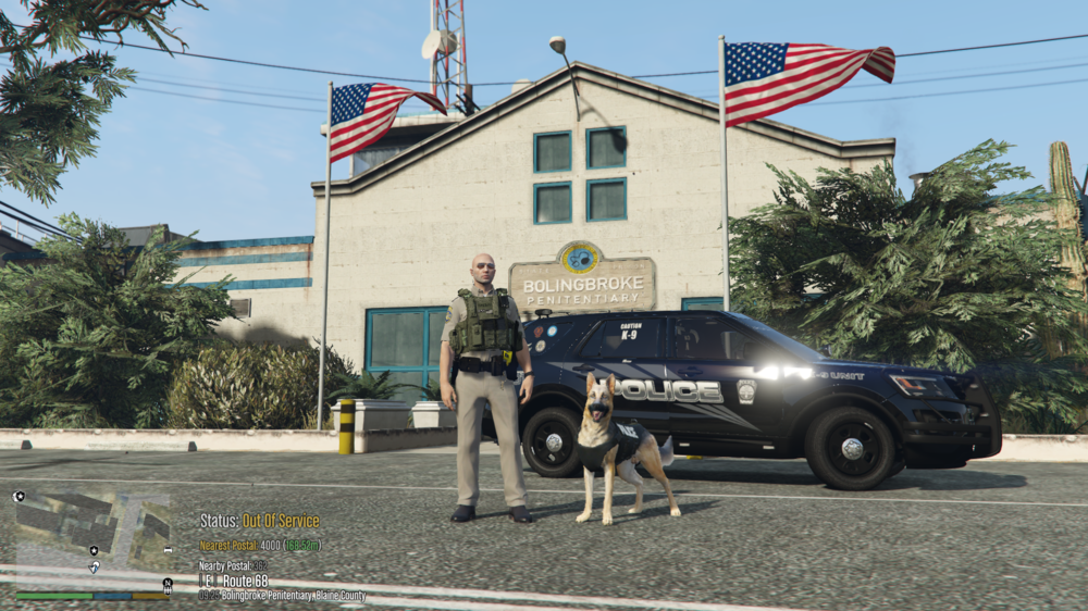 Could contain: outdoor, land vehicle, vehicle, sky, wheel, tree, road, tire, house, building, car, flag, officer, police, street