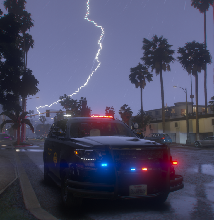 Could contain: vehicle, car, land vehicle, sky, outdoor, lightning, tree, street
