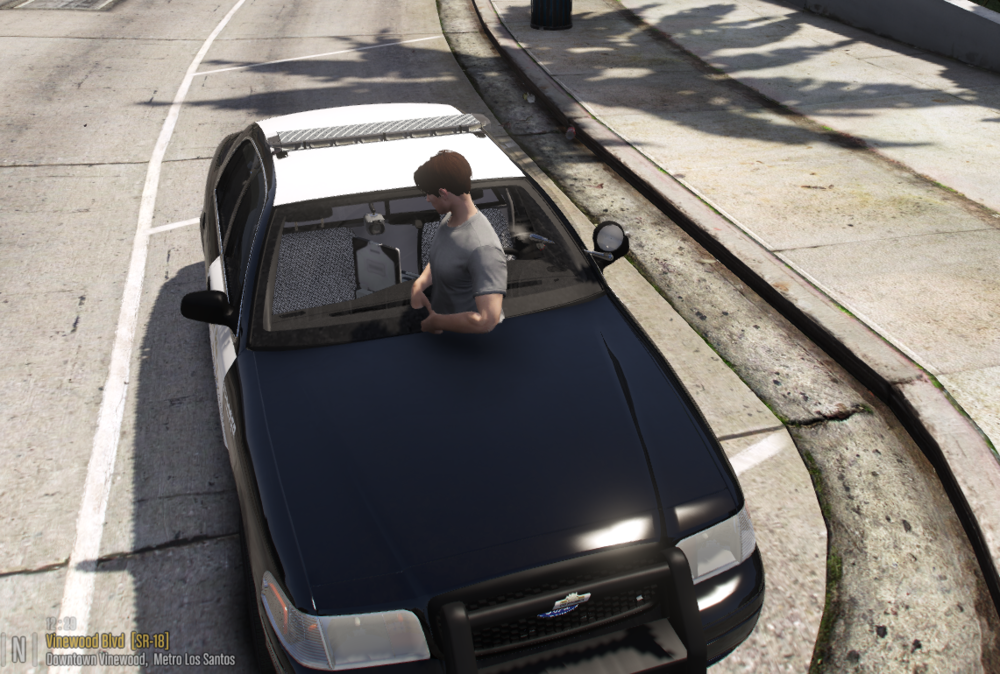 Could contain: outdoor, vehicle, land vehicle, road, person, car, ground, wheel, auto part, man, clothing, automotive design, street, supercar, driving, track