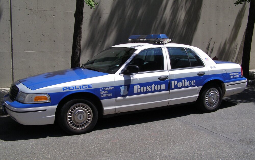 Could contain: vehicle, land vehicle, transport, wheel, police car, law enforcement, police, ford crown victoria police interceptor, outdoor, full-size car, text, tire, ford, car, emergency service, sedan, emergency vehicle, police van, parked