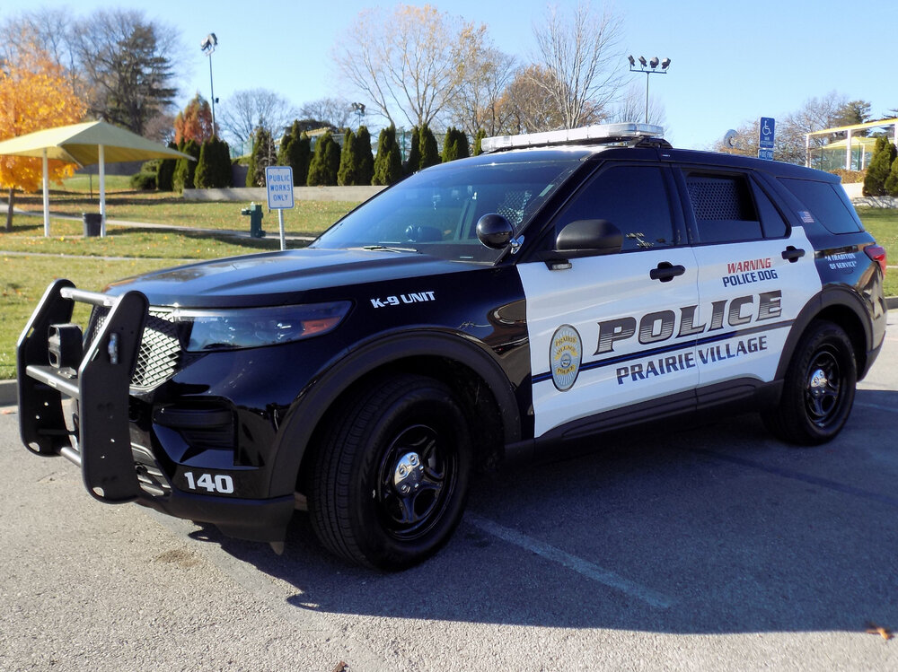 Could contain: land vehicle, vehicle, wheel, outdoor, tire, sky, transport, auto part, text, bumper, police, car, sport utility vehicle, motor vehicle, law enforcement, ford, compact sport utility vehicle, police car, automotive exterior, fender, crossover suv, mitsubishi, road, automotive tire, parked, suv