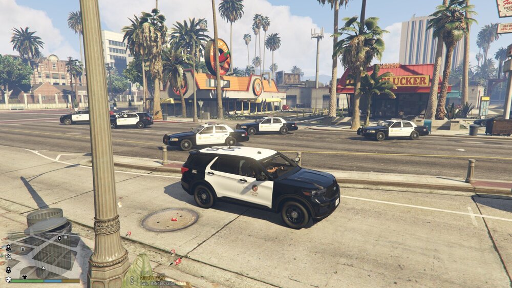 Could contain: outdoor, sky, vehicle, land vehicle, wheel, tree, car, road, palm tree, tire, ground, street