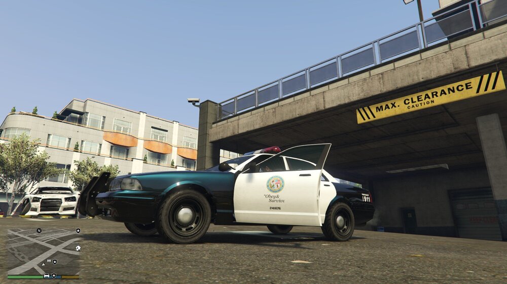 Could contain: outdoor, land vehicle, vehicle, wheel, tire, building, sky, road, auto part, motor vehicle, automotive exterior, truck, ground, parked, street, car, police